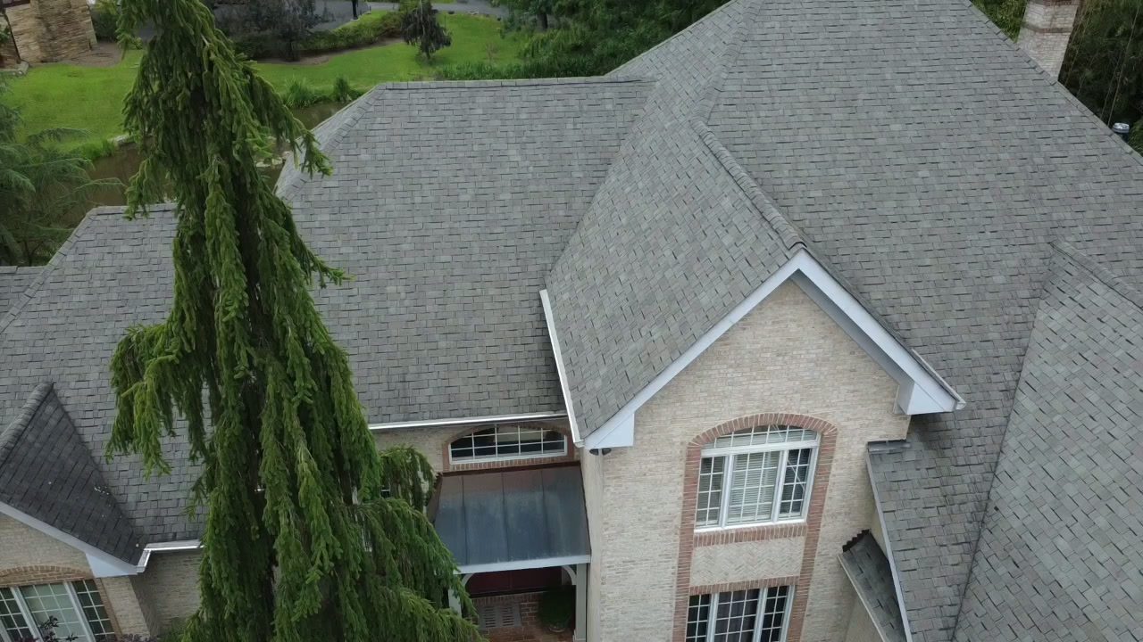 Apex Roofing and Construction yard sign in front of a home