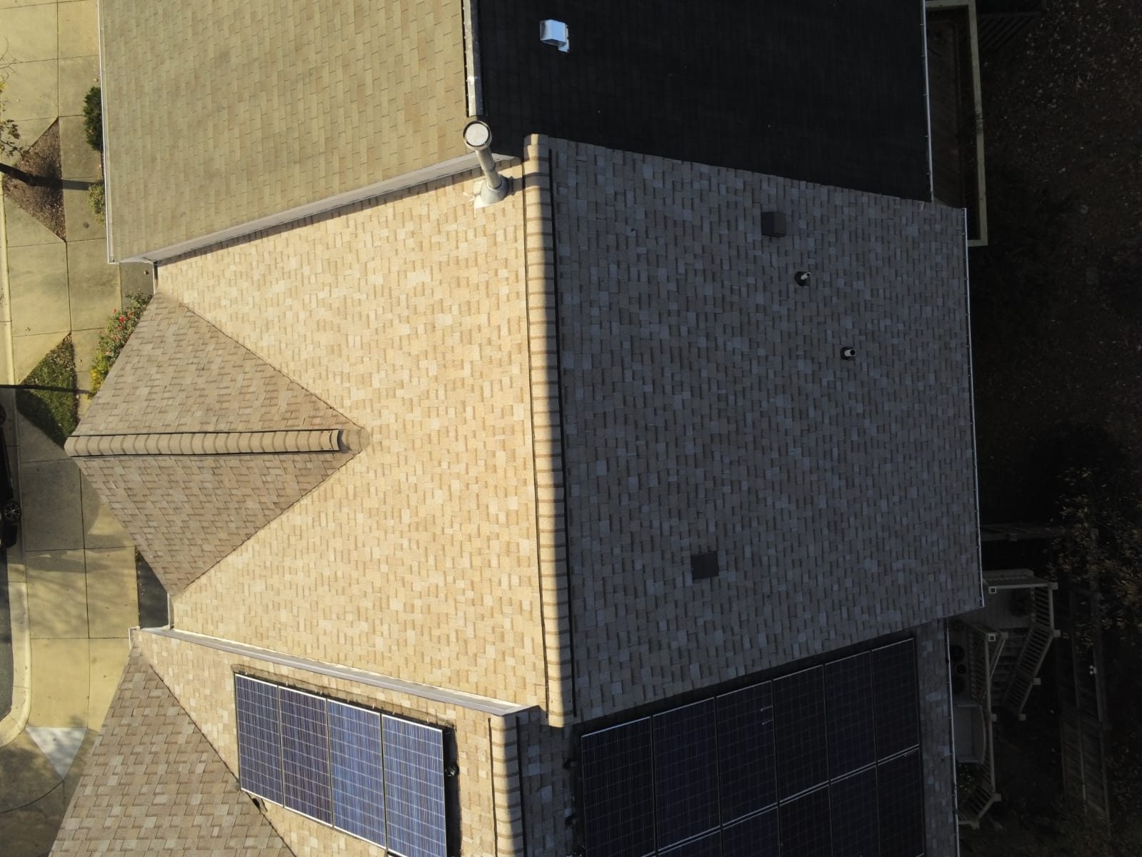 Drone inspection image of a residential roof slope, flashing and penetrations