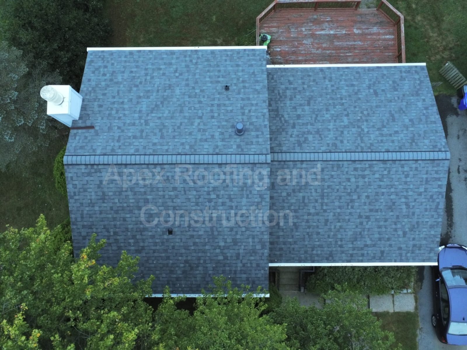 Drone photo of a completed shingle roof replacement by Apex Roofing and Construction