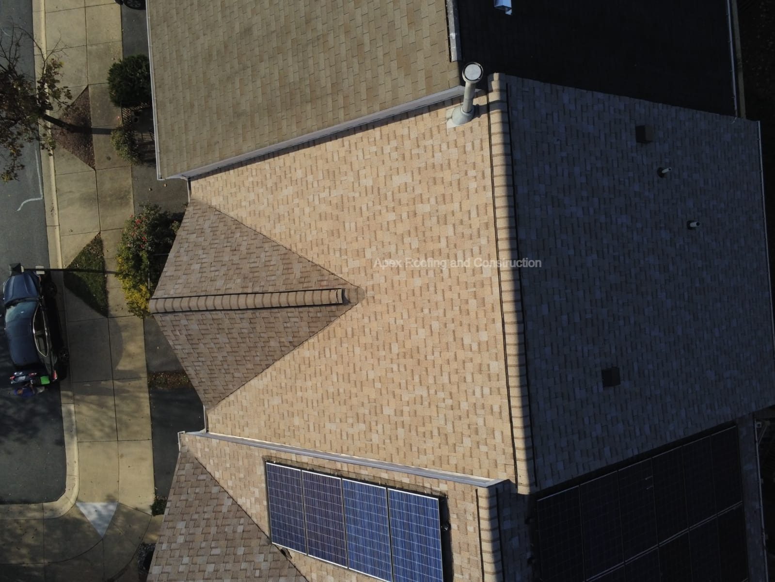 Aerial view of a completed roof replacement on a Montgomery County home